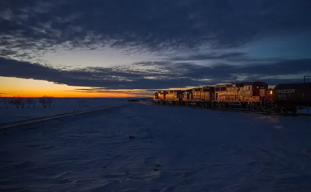 CP locomotives shunting tank cars at dusk near Wilkie